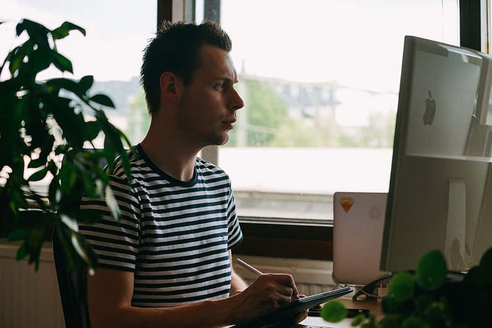 Bjorn working on his Macbook